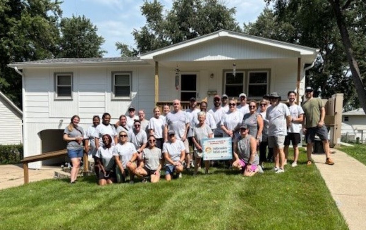 Employees painting house