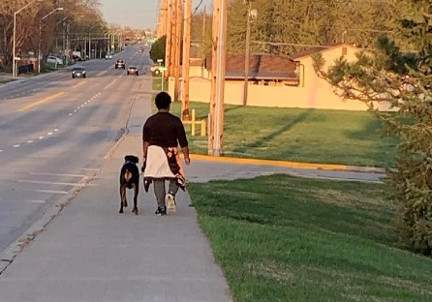 4th grader who participated in the challenge walks his dog